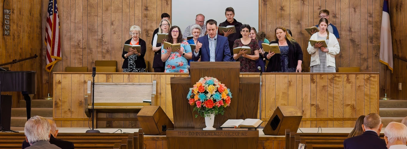 choir and choir director singing a song at Mt. Pleasant Baptist Church in Cabot